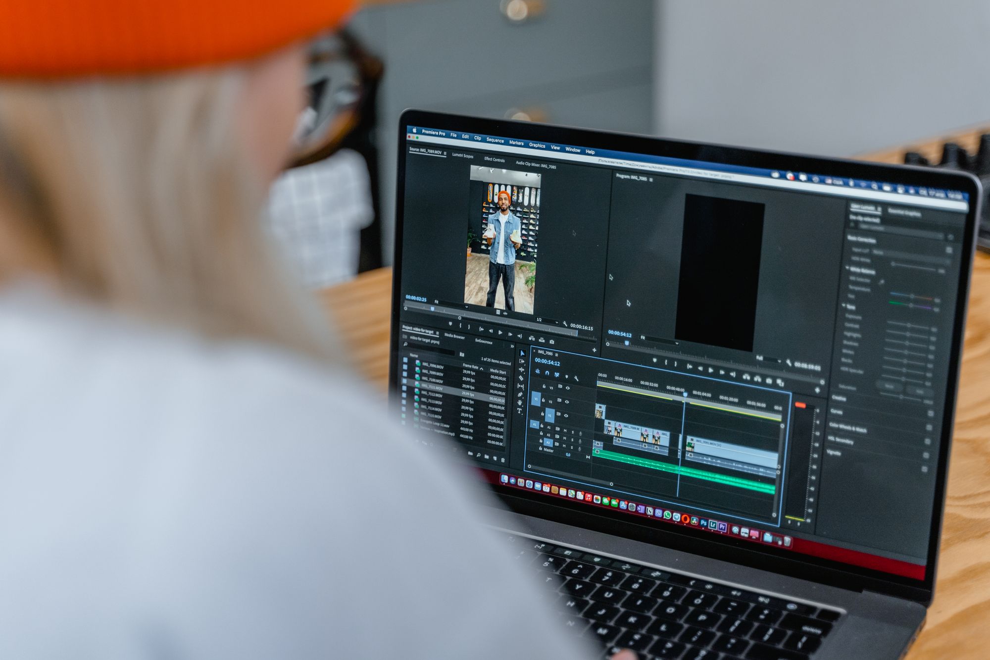 Someone editing a vertical video on a laptop timeline